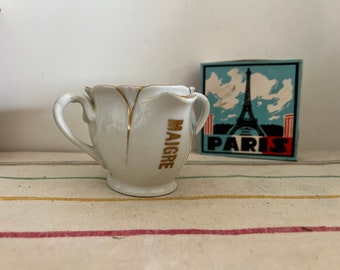 A very rare clever French Vintage white and gold porcelain gravy boat with two spouts for fatty gravy and lean gravy