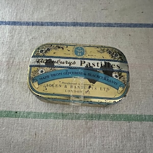 A cute little Vintage  gold and blue Allenburys Pastilles throat sweet tint pastils  rectangular tin with hinged lid