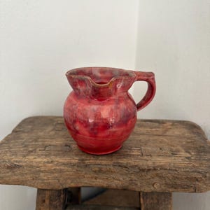 Vintage Baron Barnstaple glazed red jug, creamers, small pitcher