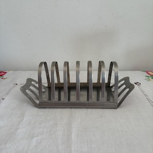 A  retro vintage  18-8 stainless steel &#39;Made in Hong Kong&#39;  1960s toast rack with slide on crumb tray