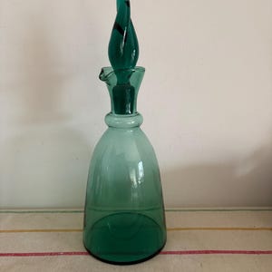 A beautiful dark green glass  French antique wine carafe with stopper