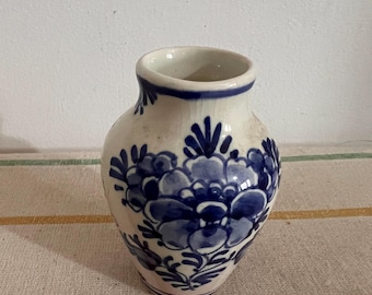 An antique  Delft Blue De Delfts Pauw factory, the Delft Peacock Dutch Holland china hand painted blue and white miniature vase