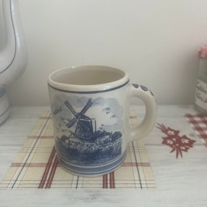 A collectible  vintage Dutch Holland  Delft Blue stamped  blue and white china mug