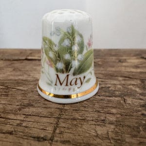A collectible bone  china thimble -  Month of May design