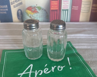 A  retro pair of ribbed glass  salt & pepper  pots with screw top chrome plated lids
