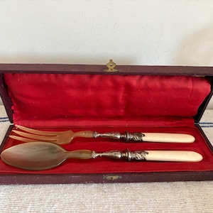 A beautiful boxed French Antique  Art Deco silver and horn spoon and fork  servers ideal to use to serve pasta or salads or vegetables