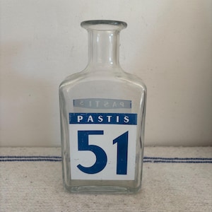 A traditional retro French Pastis 51 glass water carafe