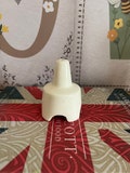 A vintage large size white china pie funnel with four cut outs around the rim