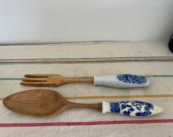 A pair of blue and white ceramic oriental inspired salad servers
