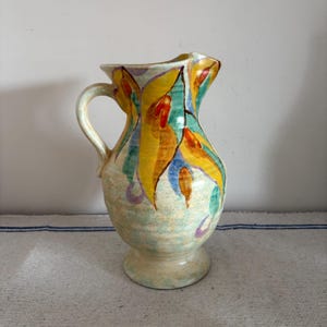 A stunning vibrant coloured  example of a hand painted  Art Deco  Beswick  Ware Ruth 72  jug pitcher vase with handle