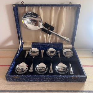 Unusual boxed Antique  Art Deco  set of six Chromium plated on Nickel Silver dessert spoons and serving spoon