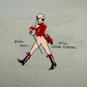 May include: An illustration of a man in a top hat and red coat walking with a cane. The text "BORN 1820 - STILL GOING STRONG" is below the illustration.