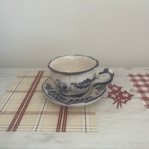 A collectible  vintage Dutch Holland  Delft Blue and white china cup and saucer
