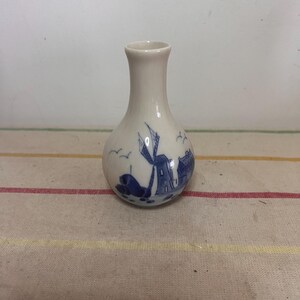 A vintageDelft Blue Dutch Holland china hand painted blue and white small vase