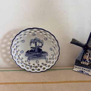 A beautiful vintage  OTS Delft Blue Dutch  Holland china hand painted blue and white trinket dish with a windmill scene