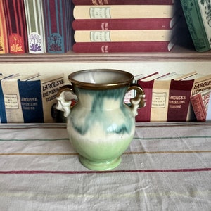 A  gorgeous French antique urn  vase in cream green shades and gold detailing  and stamped 1245/145