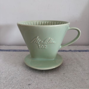 A Classic Retro  pale green   Melitta drip coffee filter paper holder funnel with handle marked  size  &#39;102&#39;
