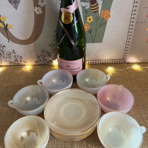 An original 1950s vintage   Arcopal Harlequin tea  set comprising six  8.5 cm diameter size cups and saucers with some wear to the gold gilt