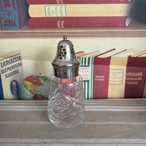 A fabulous crystal sugar caster  with a silver plated top