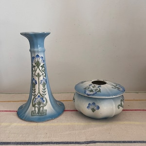 A  beautiful 1920s vintage blue and white floral  china candle holder with matching lidded pot pourri, dressing table pot