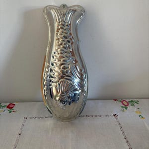 A  vintage aluminium fish mould mold for  salmon mousse, chocolate making