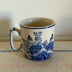 A collectible  vintage Dutch Holland  Delfts Blue and white hand painted stoneware mug