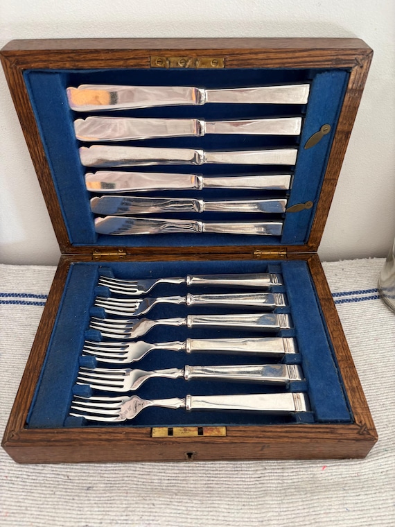 Impresionante juego de cubiertos para pescado de madera de roble