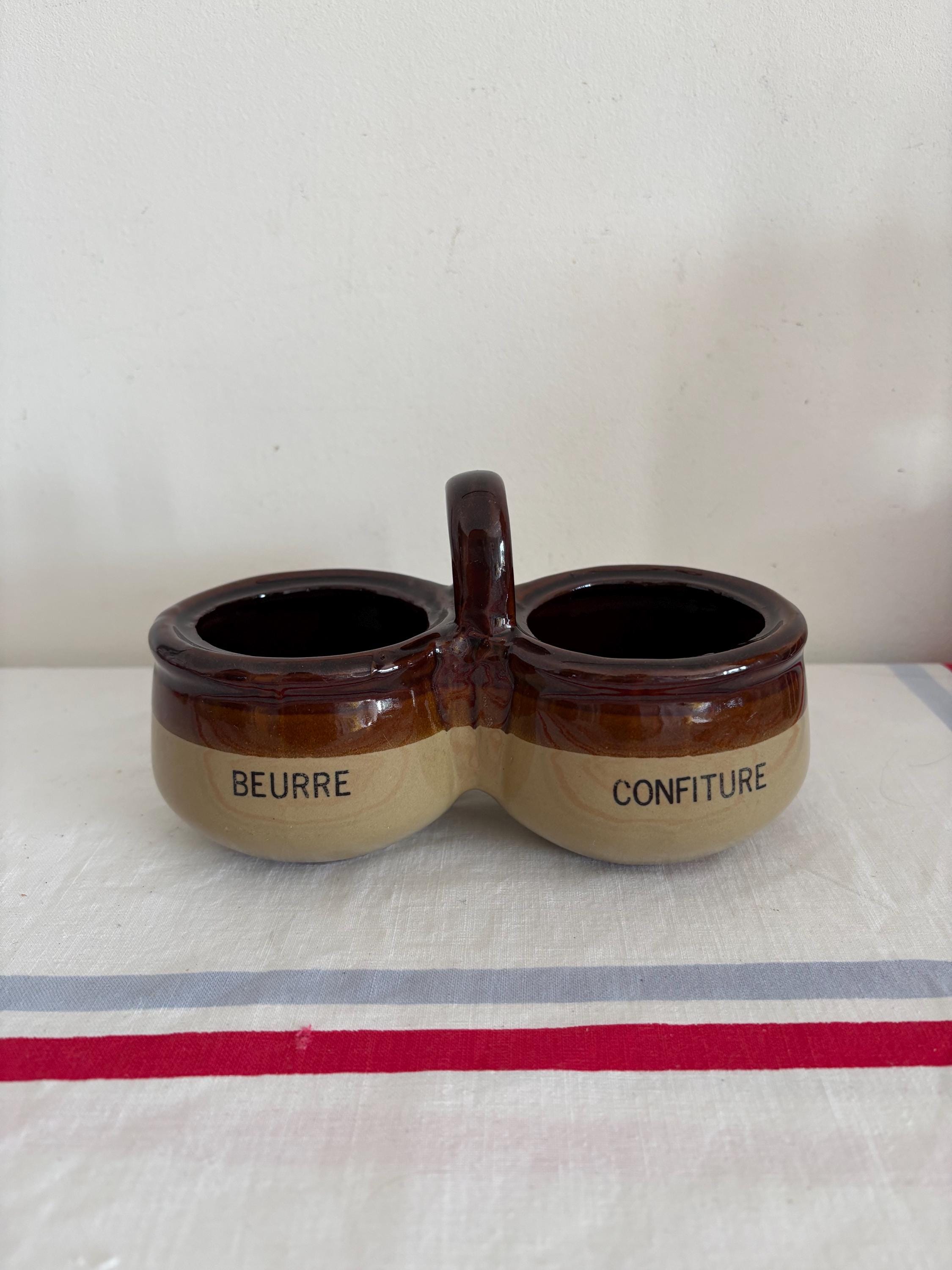 A vintage French farmhouse duo set of glazed rustic stoneware beurre et confiture, butter and jam pots joined by a central handle