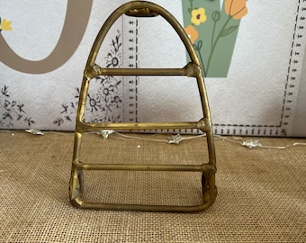 A French  vintage brass  iron shaped trivet stand rest