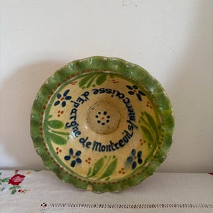 A unique hand painted pottery dish made from green clay, stoneware decorated for Caisse D&#39;Epargne Montreuil sur Mer