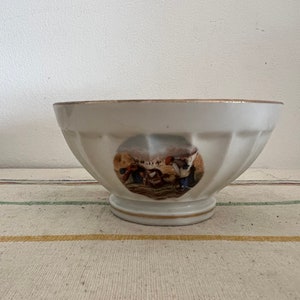 A  very pretty  petite fluted  French antique CNP porcelain  coffee cafe au lait bowl with a gold  rim décor and harvest scene