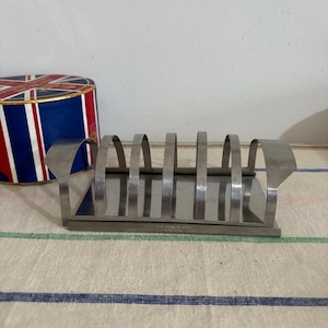 A  retro vintage  18-8 stainless steel &#39;Made in Hong Kong&#39;  1960s toast rack with slide on crumb tray