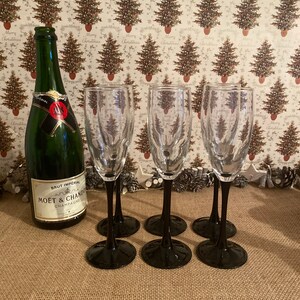 A delightful set of six French vintage Luminarc clear crystal  black stemmed glass champagne, prosecco  flutes