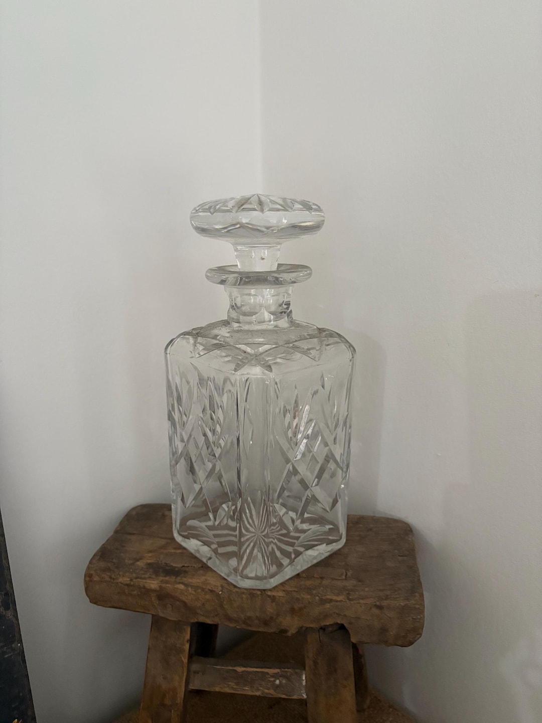A Cut Glass Square Shaped Decanter With a Flat Faceted Stopper ...