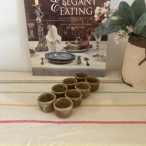 A traditional set of  8 French vintage oven proof individual stoneware snail dishes