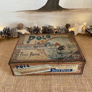 A  delightful very rare iconic French  vintage  1920s Felix Potin Polo Gaufrettes Fourrees au Praline red, gold and blue  metal lidded tin