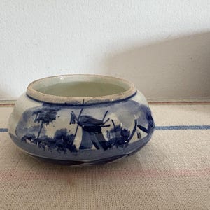 A beautiful vintage  Delft Blue Dutch  Holland china hand painted blue and white trinket dish with windmill scene