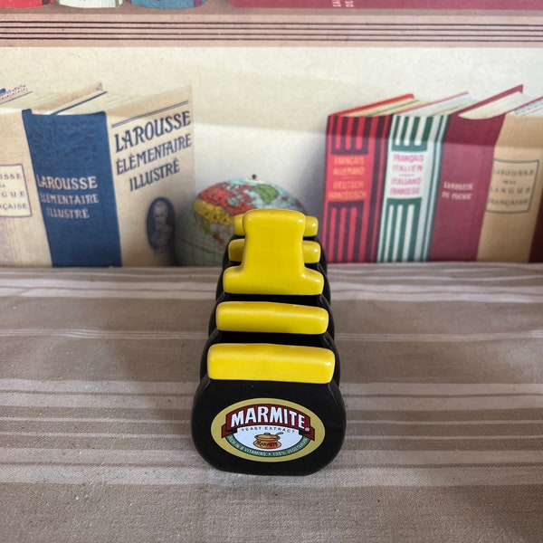 A quirky vintage  Marmite black and yellow china four slice  toast rack