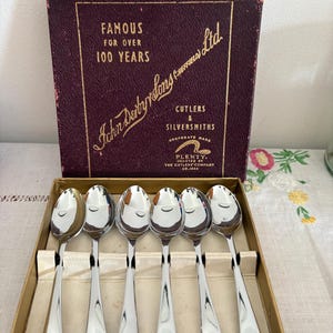 A gorgeous John Derby & Sons Sheffield boxed  set of stainless chromium plate Art Deco teaspoons
