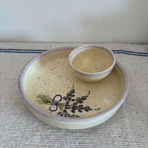 An unusual lavender design French vintage  rustic glazed cream with lilac rim dish for serving olives with a place for stones
