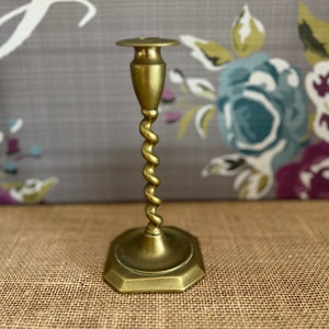 An antique twisted  brass candle holder candlestick from the early 20th century