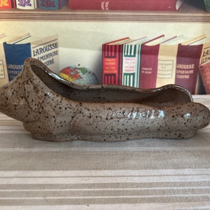 A delightful extra long French vintage caramel brown colour ceramic  pig saucisson plate
