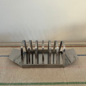 A vintage stainless steel 1960s two part  toast rack and crumb tray