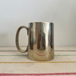 An antique silver plated EPNS  WW Robert Pringle half  pint capacity tankard ( not engraved)
