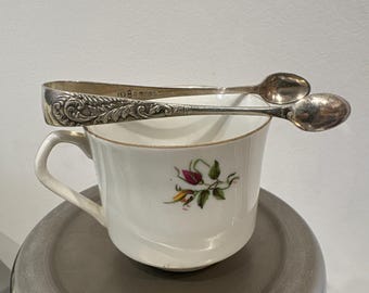 A lovely ornate silver plated EP A1  sugar tongs from the early 1900s