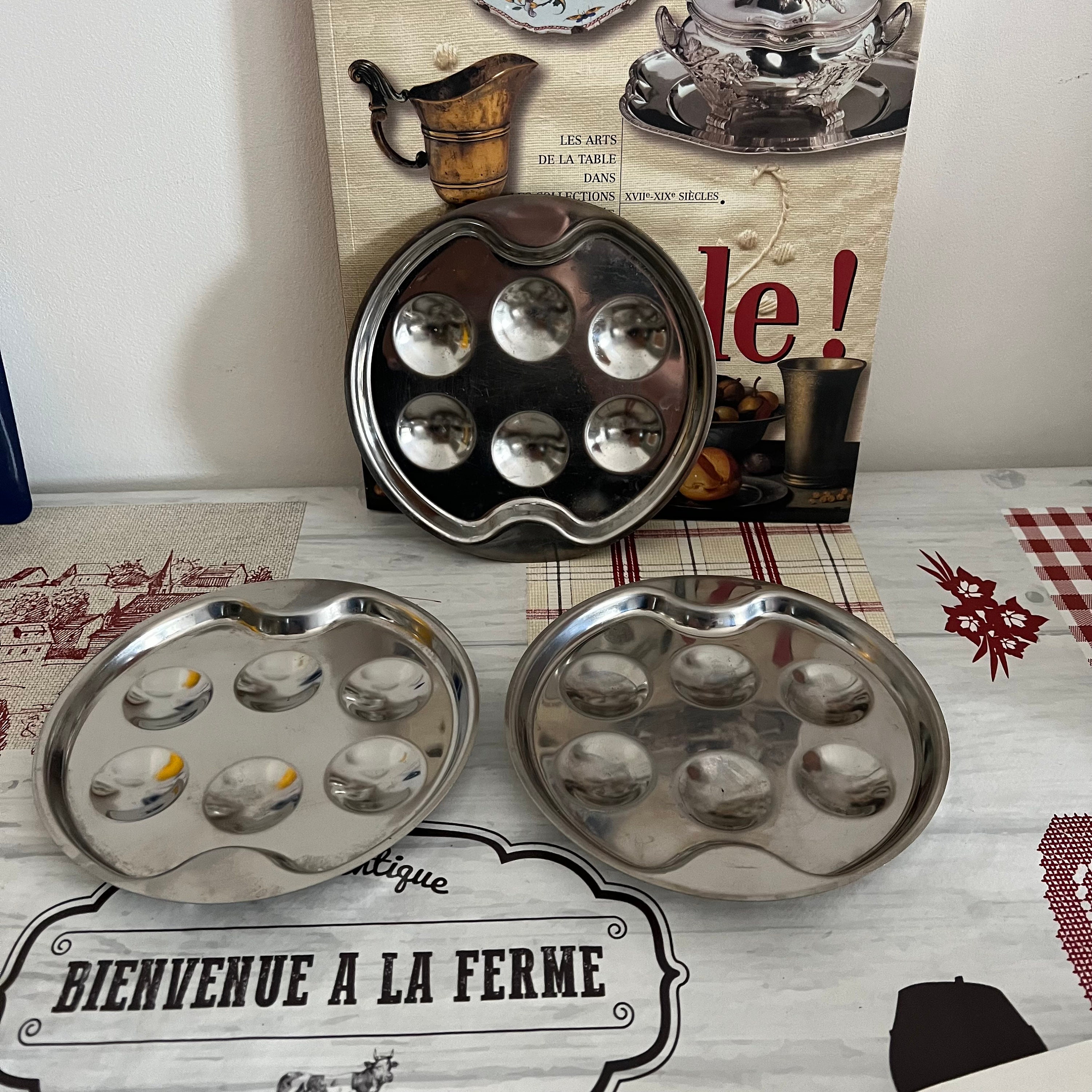 A set of three  traditional French vintage round stainless steel escargot snail dishes