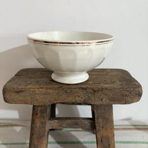 An antique MDL ( Moulin des Loups white cafe au lait  coffee bowl with gold edge detailing