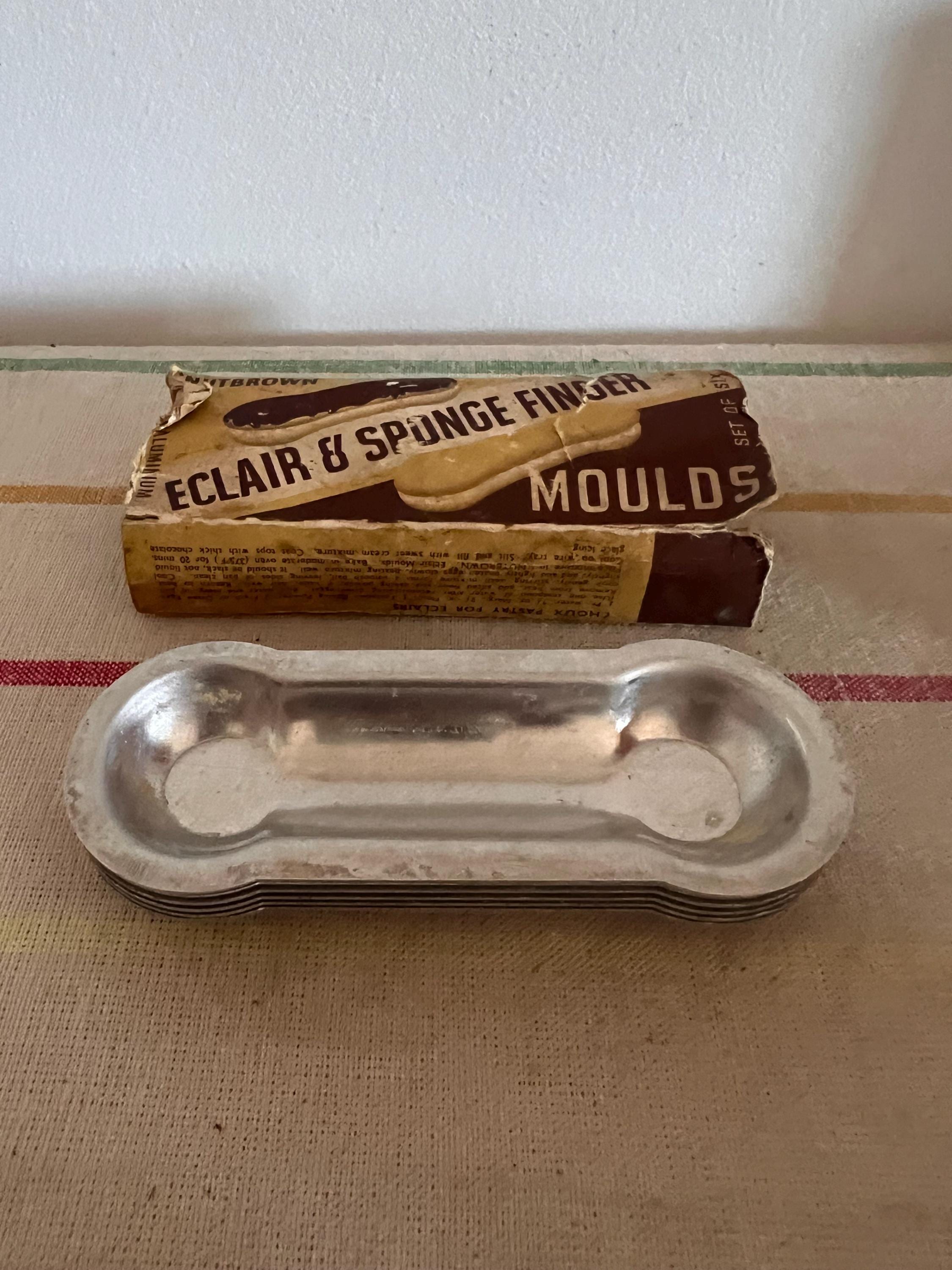 A vintage set of six  pure aluminium Nutbrown Eclair and Sponge Finger Moulds  in their original box