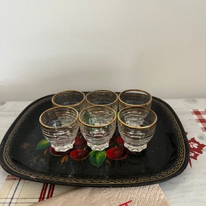 An original 1950s set of 6 French shot glasses  with a pretty gold striped pattern