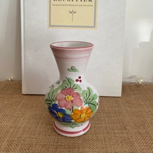 A beautiful hand painted  Italian Firenze Mediterranean terracotta glazed ceramic vase with a green, blue,  orange and pink floral design